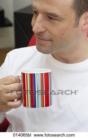 portrait of man having a tea break at home View Large Photo Image Stock Image - portrait of man having a tea break at home. Fotosearch