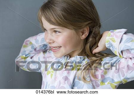 Stock Image - portrait of smiling girl in nightgown. Fotosearch