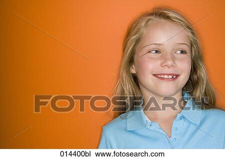 portrait of smiling girl with orange background View Large Photo Image Stock Image - portrait of smiling girl with orange background. Fotosearch