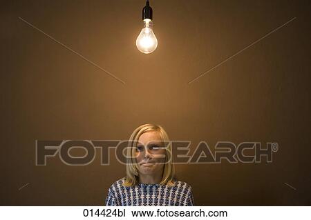 portrait of teenager under lightbulb thinking heavily View Large Photo Image Stock Image - portrait of teenager under lightbulb thinking heavily. Fotosearch