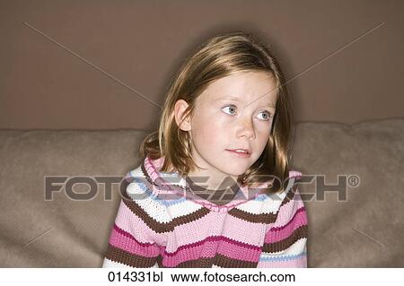 portrait of wistful looking girl on sofa View Large Photo Image Stock Image - portrait of wistful looking girl on sofa. Fotosearch