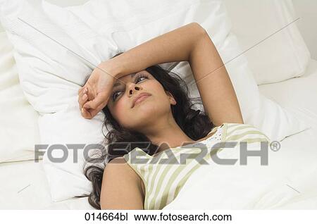 portrait of woman lying in her bed View Large Photo Image Stock Image - portrait of woman lying in her bed. Fotosearch