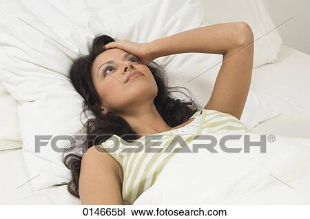 portrait of woman lying in her bed View Large Photo Image Stock Image - portrait of woman lying in her bed. Fotosearch