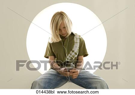 portrait of young boy listening to music on ipod View Large Photo Image Stock Image - portrait of young boy listening to music on ipod. Fotosearch