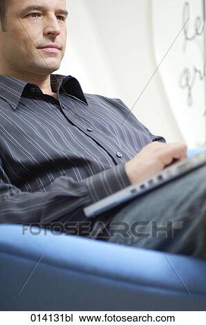 portrait of young businessman with notebook computer thinking View Large Photo Image Stock Image - portrait of young businessman with notebook computer thinking. Fotosearch