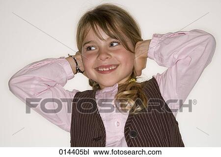 Stock Image - portrait of young girl covering her ears. Fotosearch