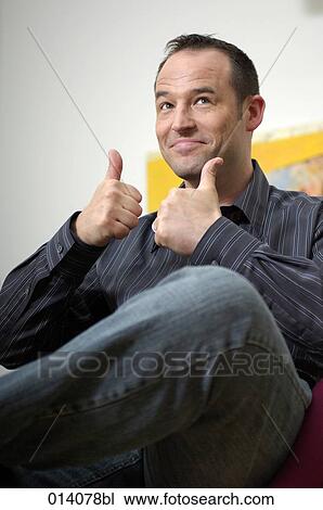 portrait of young man doing thumbs up sign View Large Photo Image Stock Image - portrait of young man doing thumbs up sign. Fotosearch