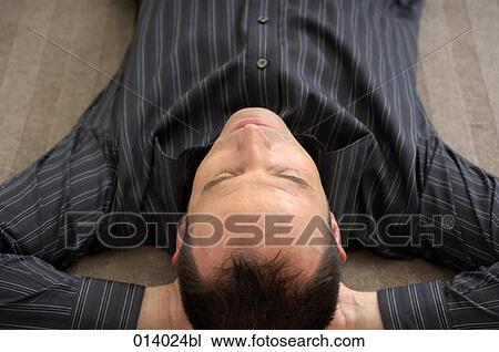 portrait of young man lying on floor sleeping View Large Photo Image Stock Image - portrait of young man lying on floor sleeping. Fotosearch