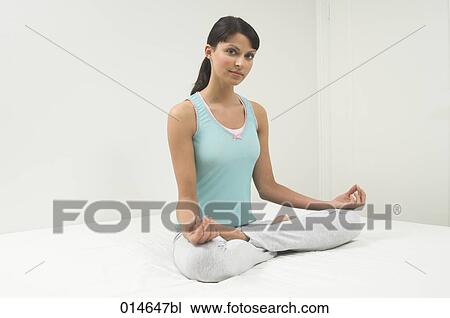 portrait of young woman doing yoga in bedroom View Large Photo Image Stock Image - portrait of young woman doing yoga in bedroom. Fotosearch