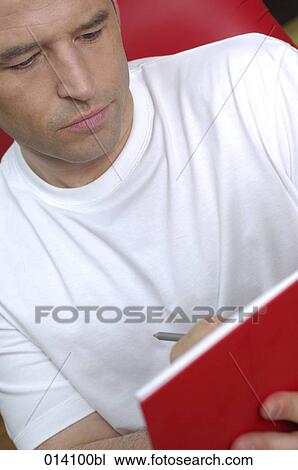portrait of young writing in his journal View Large Photo Image Stock Image - portrait of young writing in his journal. Fotosearch