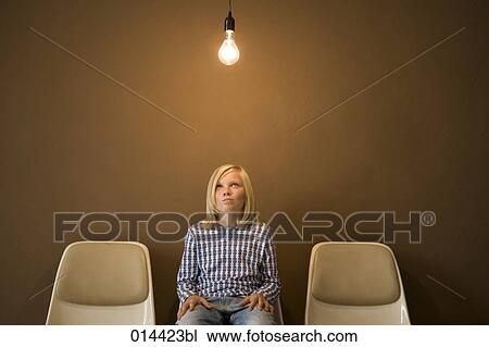 sitting boy thinking under illuminated light bulb View Large Photo Image Stock Image - sitting boy thinking under illuminated light bulb. Fotosearch