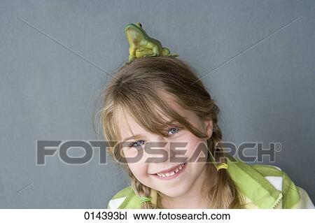 smiling girl with frog on head looking at camera View Large Photo Image Stock Image - smiling girl with frog on head looking at camera. Fotosearch