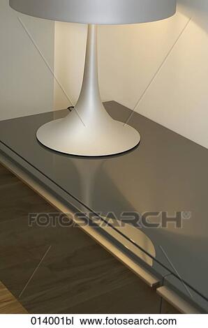 Stock Image - still life of stylish lamp on table. Fotosearch
