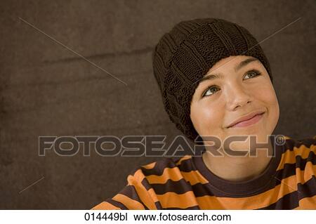 teenage boy smiling mischievously View Large Photo Image Stock Image - teenage boy smiling mischievously. Fotosearch