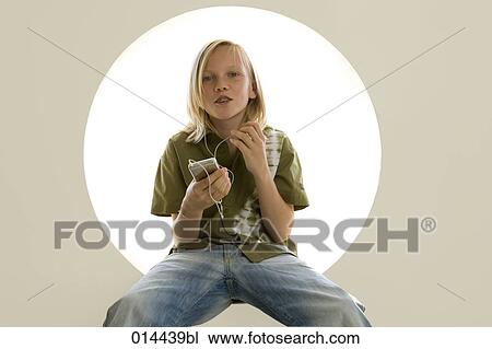 teenage boy using mp3 player View Large Photo Image Stock Image - teenage boy using mp3 player. Fotosearch