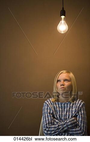 thoughtful teenage boy looking at lamp View Large Photo Image Stock Image - thoughtful teenage boy looking at lamp. Fotosearch