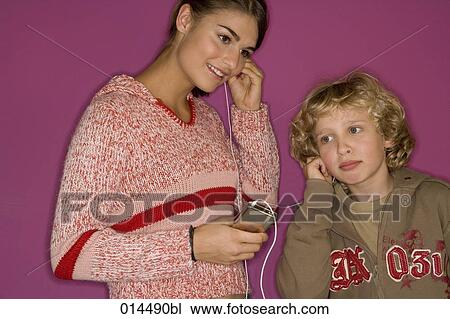 two siblings sharing a mp3 player View Large Photo Image Stock Image - two siblings sharing a mp3 player. Fotosearch