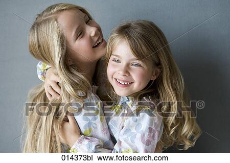 two sisters in nightgowns embracing View Large Photo Image Stock Image - two sisters in nightgowns embracing. Fotosearch