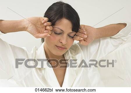 woman in white pajamas rubbing her eyes in the morning View Large Photo Image Stock Image - woman in white pajamas rubbing her eyes in the morning. Fotosearch