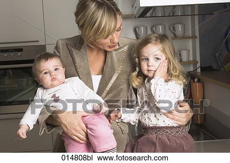 young businesswoman with her daughters one looking moody View Large Photo Image Stock Image - young businesswoman with her daughters one looking moody. Fotosearch