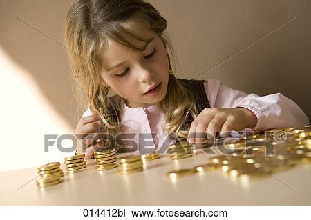 young girl counting her money on table View Large Photo Image Stock Image - young girl counting her money on table. Fotosearch