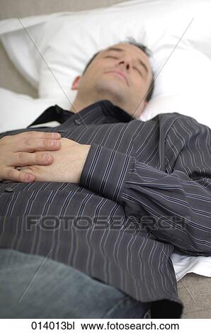 young man sleeping on his pillow View Large Photo Image Stock Image - young man sleeping on his pillow. Fotosearch