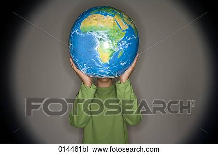 young person in green holding inflatable globe up View Large Photo Image Stock Image - young person in green holding inflatable globe up. Fotosearch