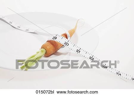carrot on plate with tape measure View Large Photo Image Stock Image - carrot on plate with tape measure. Fotosearch