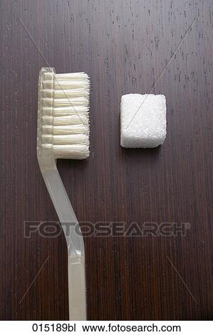 close-up of toothbrush and sugar cube View Large Photo Image Stock Image - close-up of toothbrush and sugar cube. Fotosearch