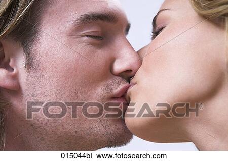 close-up of young couple kissing each other View Large Photo Image Stock Image - close-up of young couple kissing each other. Fotosearch