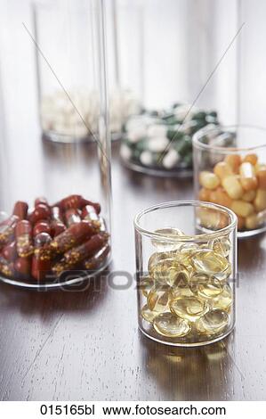 different pills and capsules in glass jars View Large Photo Image Stock Image - different pills and capsules in glass jars. Fotosearch