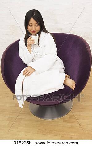 full body portrait of young japanese woman sitting on arm chair drinking glass of milk View Large Photo Image Stock Image - full body portrait of young japanese woman sitting on arm chair drinking glass of milk. Fotosearch