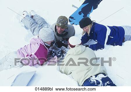 group of four friends sitting in snow talking and drinking mulled wine View Large Photo Image Stock Image - group of four friends sitting in snow talking and drinking mulled wine. Fotosearch