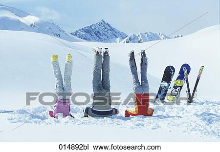 group of three friends doing head stand in snow View Large Photo Image Stock Image - group of three friends doing head stand in snow. Fotosearch