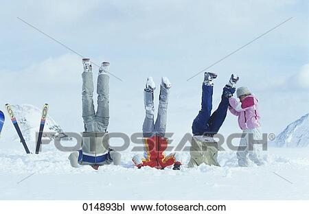 group of three friends doing head stand in snow View Large Photo Image Stock Image - group of three friends doing head stand in snow. Fotosearch