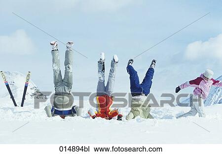 group of three friends doing head stand in snow View Large Photo Image Stock Image - group of three friends doing head stand in snow. Fotosearch
