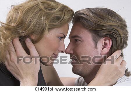 headshot of young couple tenderly looking at each other View Large Photo Image Stock Image - headshot of young couple tenderly looking at each other. Fotosearch