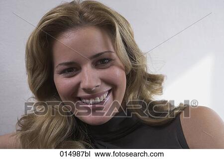 headshot of young woman smiling at camera View Large Photo Image Stock Image - headshot of young woman smiling at camera. Fotosearch