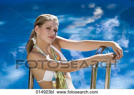 portrait of arrogant looking teenage girl at swimming pool View Large Photo Image Stock Image - portrait of arrogant looking teenage girl at swimming pool. Fotosearch
