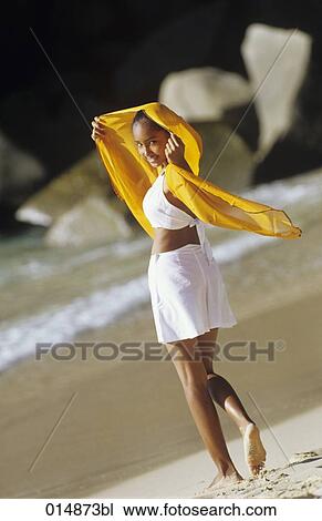 portrait of smiling indigenous teenage girl wearing orange veil on tropical beach View Large Photo Image Stock Image - portrait of smiling indigenous teenage girl wearing orange veil on tropical beach. Fotosearch