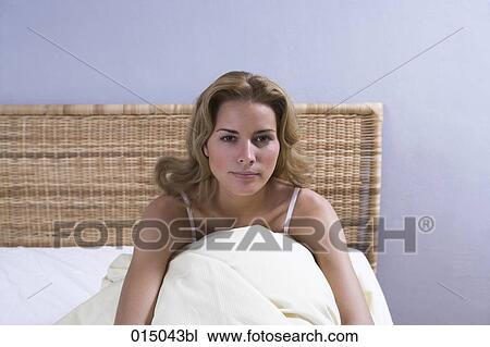 portrait of young blonde sitting alone in her bed View Large Photo Image Stock Image - portrait of young blonde sitting alone in her bed. Fotosearch