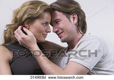 portrait of young couple tenderly looking at each other View Large Photo Image Stock Image - portrait of young couple tenderly looking at each other. Fotosearch