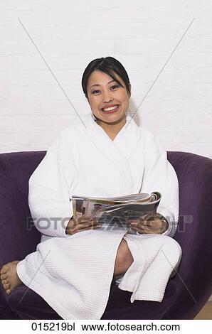 portrait of young japanese woman in bathrobe reading magazine View Large Photo Image Stock Image - portrait of young japanese woman in bathrobe reading magazine. Fotosearch