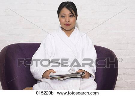 portrait of young japanese woman in bathrobe reading magazine View Large Photo Image Stock Image - portrait of young japanese woman in bathrobe reading magazine. Fotosearch