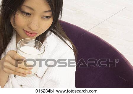 portrait of young japanese woman drinking glass of milk View Large Photo Image Stock Image - portrait of young japanese woman drinking glass of milk. Fotosearch