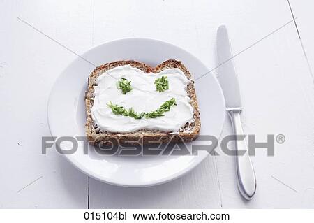 sandwich with cream cheese and face formed from chives View Large Photo Image Stock Image - sandwich with cream cheese and face formed from chives. Fotosearch