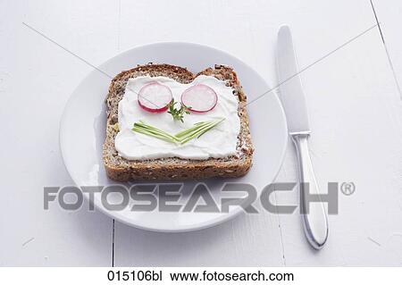 sandwich with cream cheese and face formed from chives and radishes View Large Photo Image Stock Image - sandwich with cream cheese and face formed from chives and radishes. Fotosearch