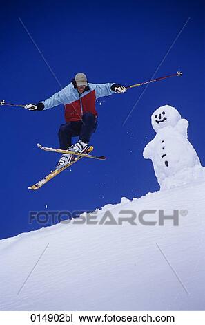 skier jumping with snowman in background View Large Photo Image Stock Image - skier jumping with snowman in background. Fotosearch