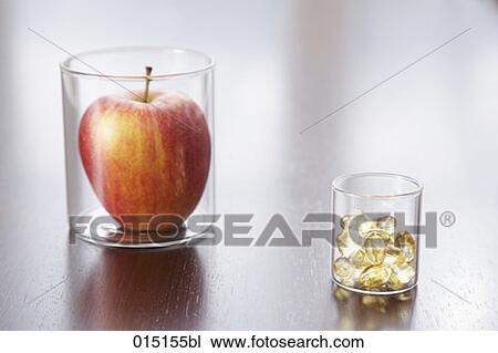 still life of apple and pills in jars View Large Photo Image Stock Image - still life of apple and pills in jars. Fotosearch