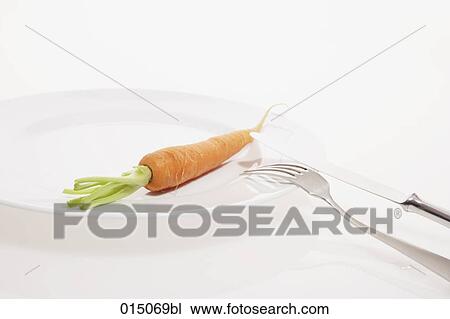 still life of carrot on table with knife and fork View Large Photo Image Stock Image - still life of carrot on table with knife and fork. Fotosearch